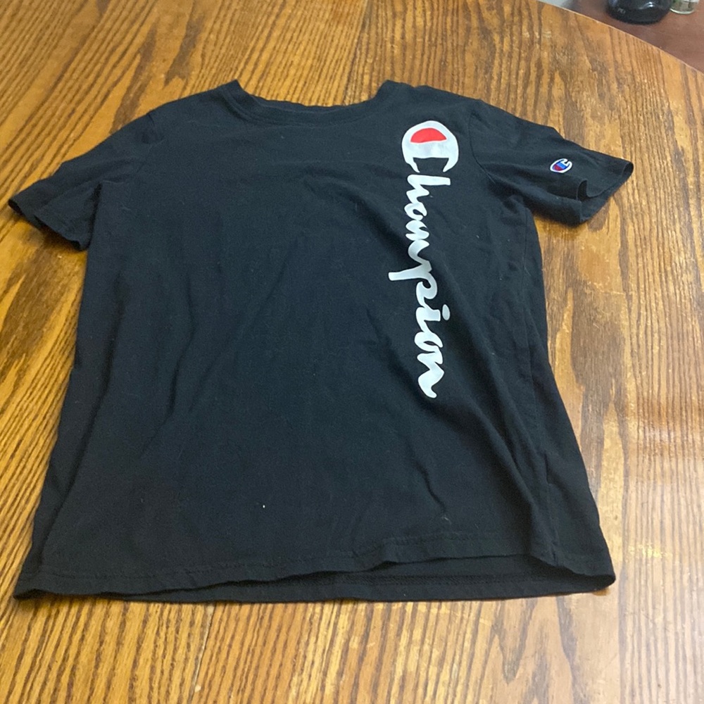 Slightly worn champion black t-shirt.